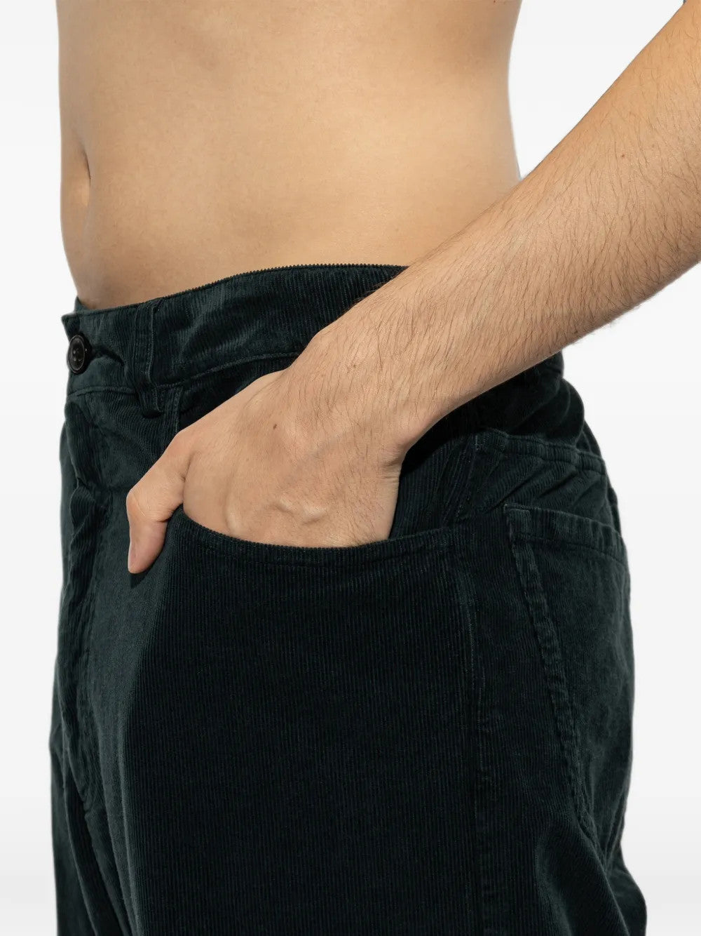Green pants worn by a person, showing the pants fit