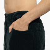 Green pants worn by a person, showing the pants fit