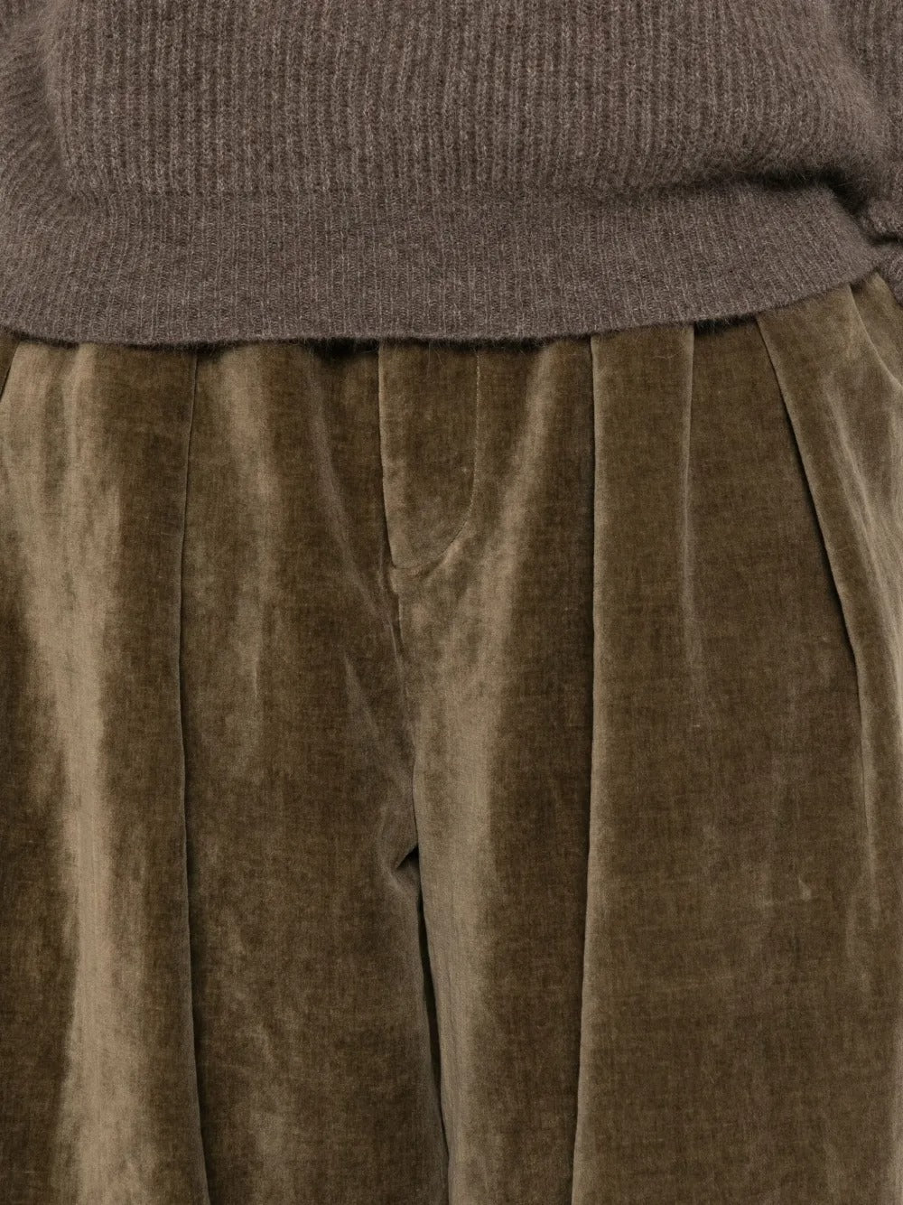 Close up of brown pant, showing the texture of cotton fabric