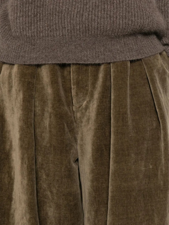Close up of brown pant, showing the texture of cotton fabric