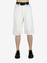 White short worn by a person, showing the short's fit