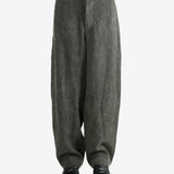 Grey pants worn by a person, showing the pants's fit