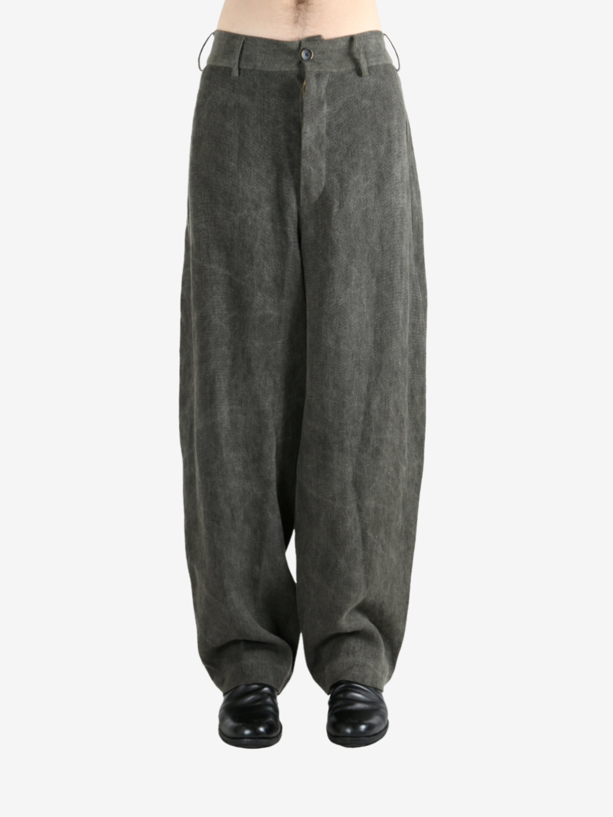 Grey pants worn by a person, showing the pants's fit