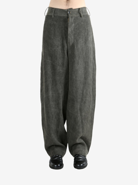 Grey pants worn by a person, showing the pants's fit