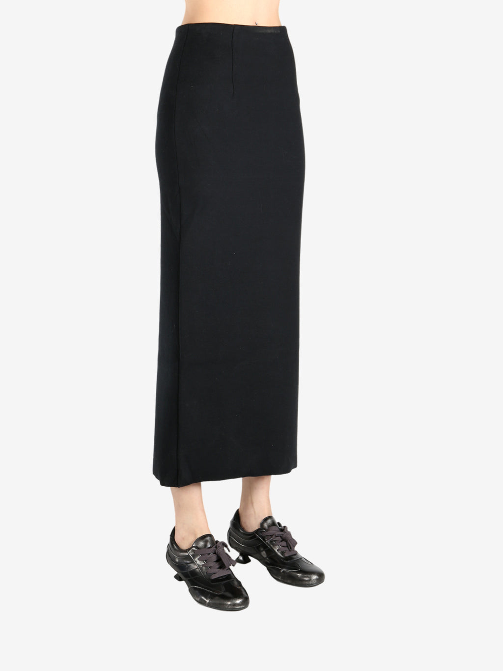 Black dress worn by a person, showing the dress fit