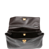 Close up of black bag, showing texture of the leather fabric