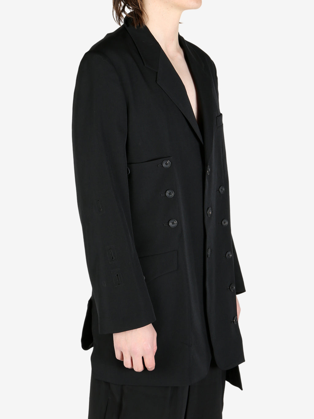 Black jacket worn by a person, showing the jacket's fit