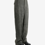 Grey pants worn by a person, showing the pants's fit