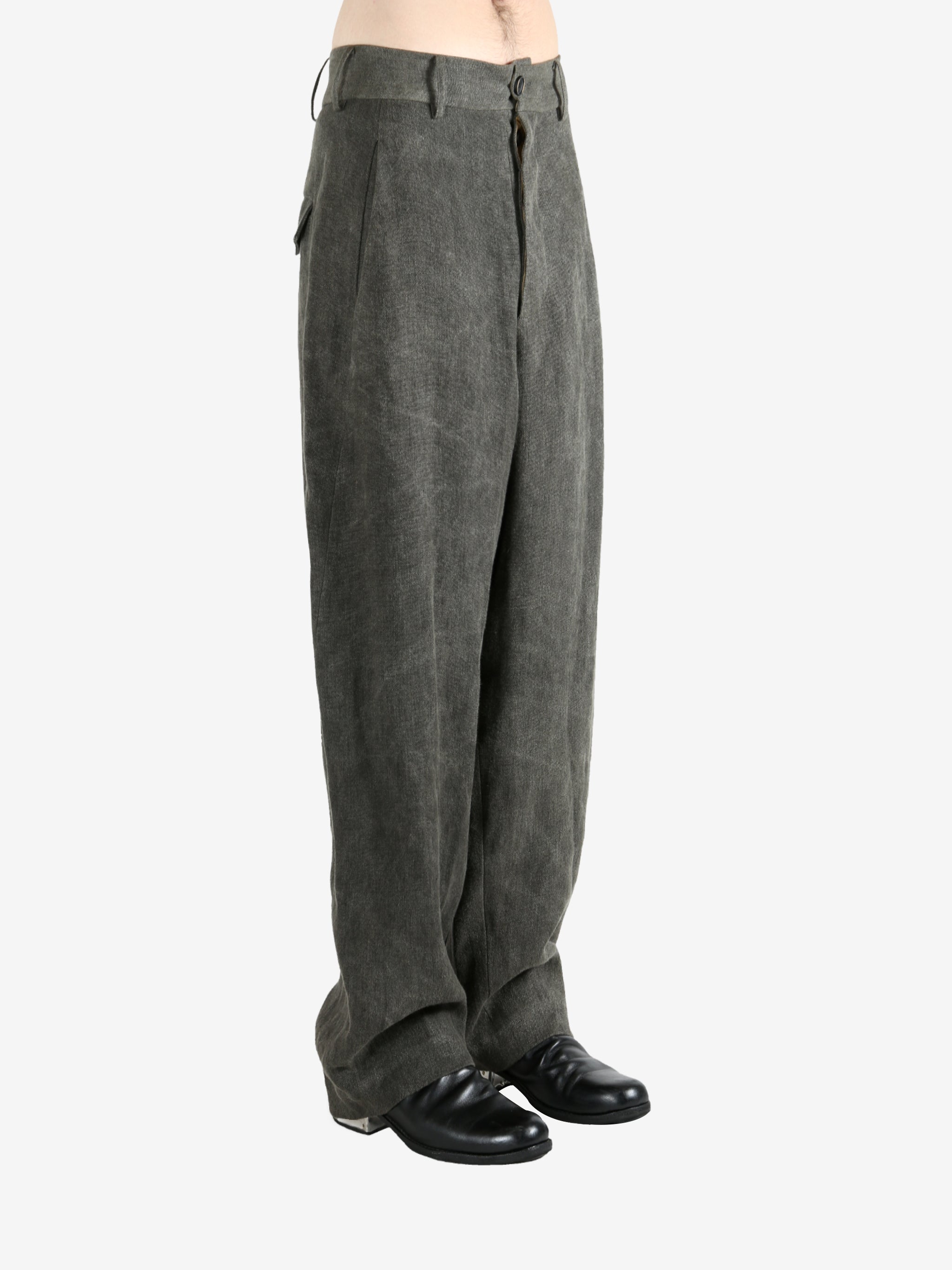 Grey pants worn by a person, showing the pants's fit