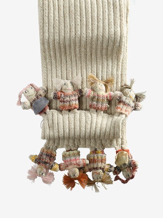 lose up of white scarves, showing texture of the wool and cotton and linen fabric