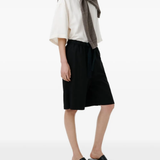 Black shorts, full body view