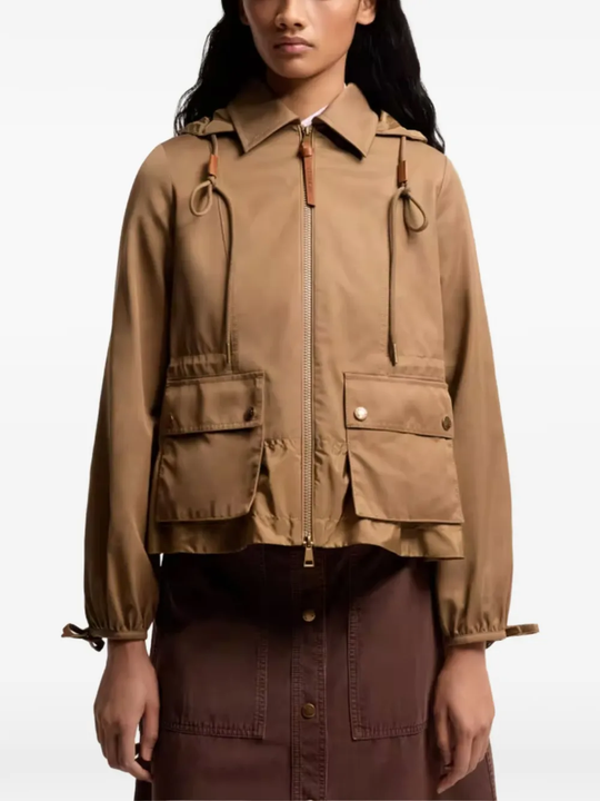 Brown jackets-coats worn by a person, showing the jackets-coats's fit