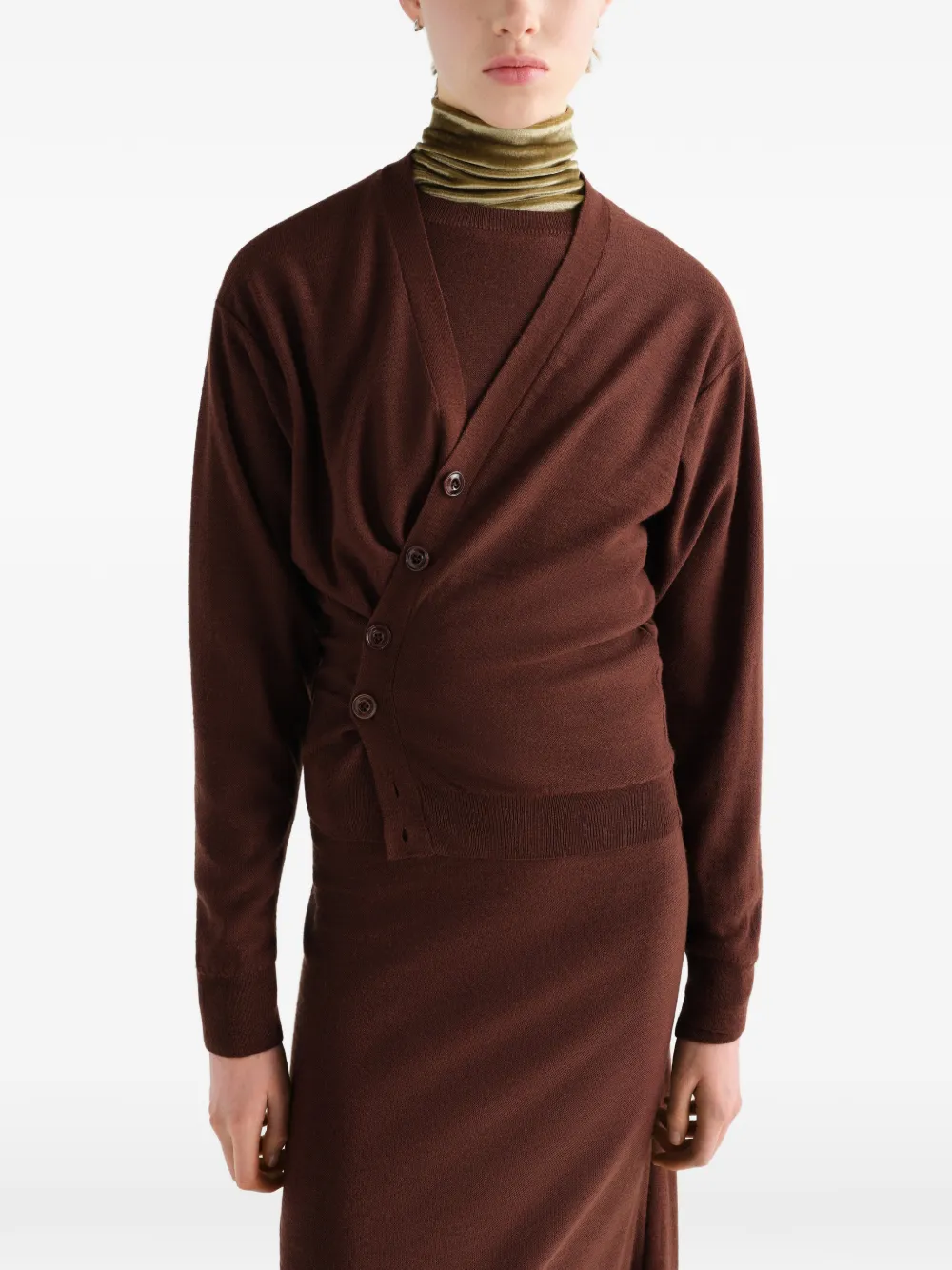 Brown knitwear worn by a person, showing the knitwear fit