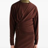 Brown knitwear worn by a person, showing the knitwear fit