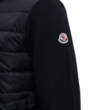 Black hoodie worn by a person, showing the hoodie fit