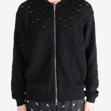 Black jackets worn by a person, showing the jackets fit