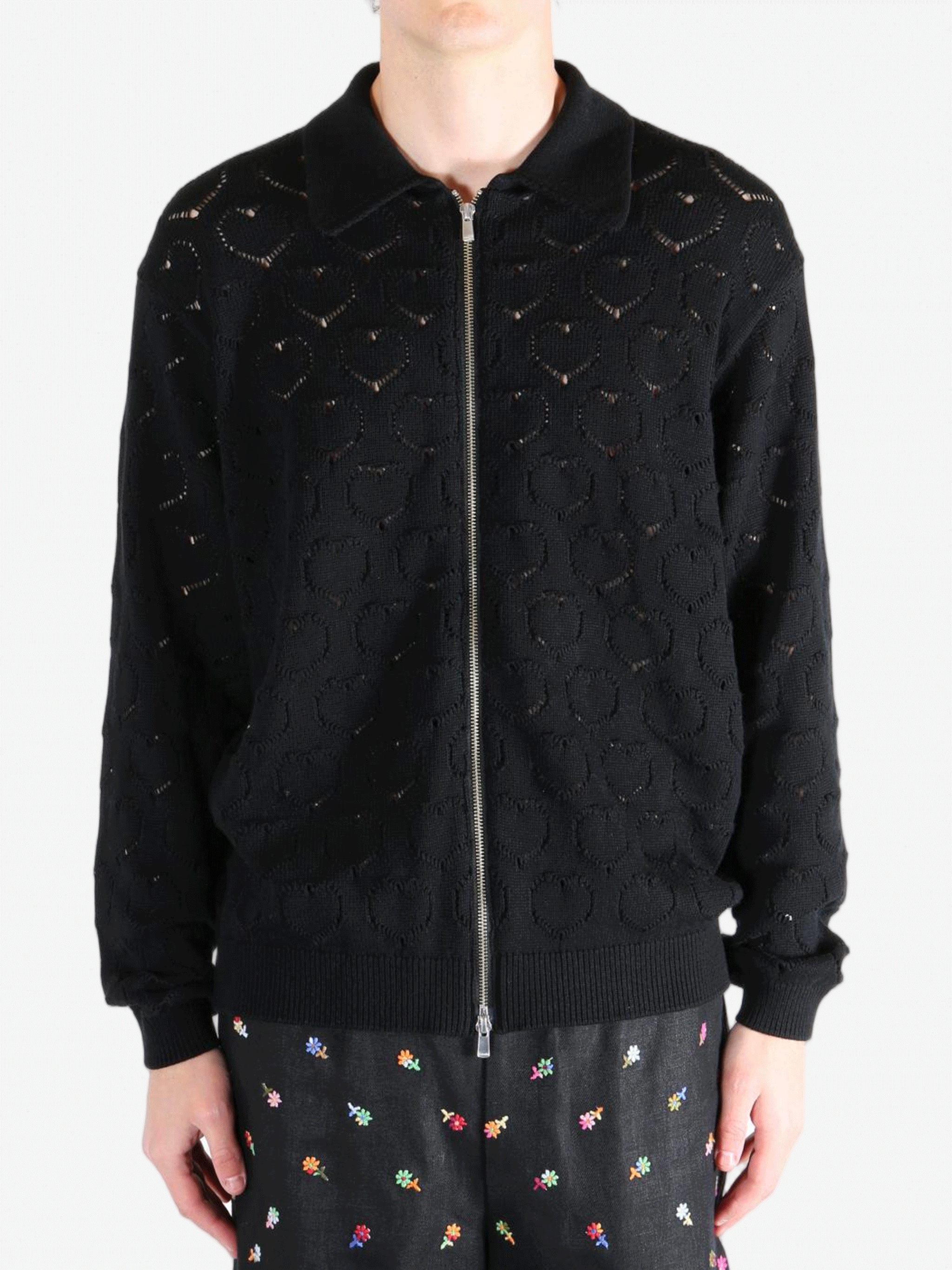 Black jackets worn by a person, showing the jackets fit