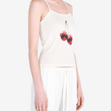White top worn by a person, showing the top fit