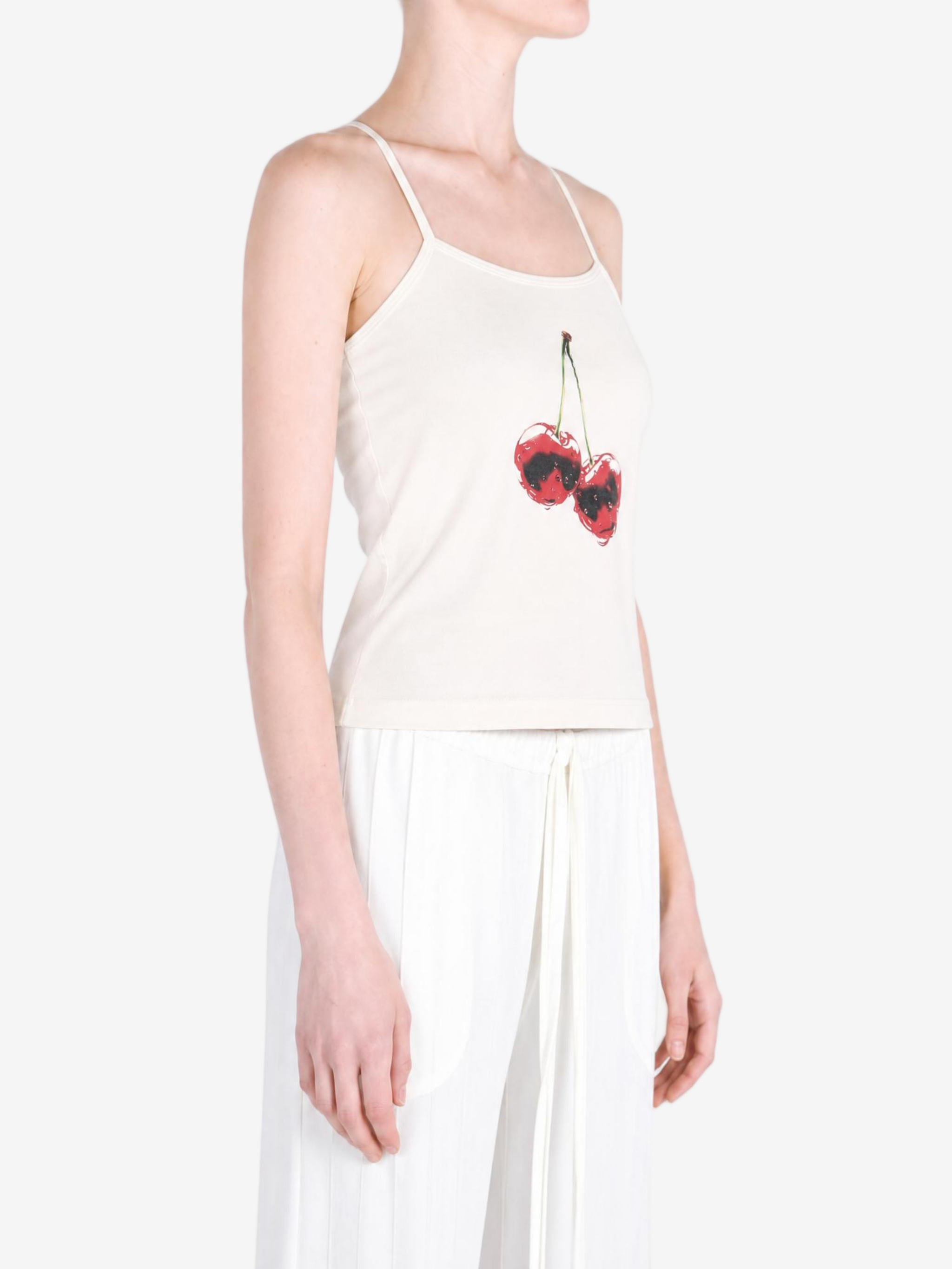 White top worn by a person, showing the top fit
