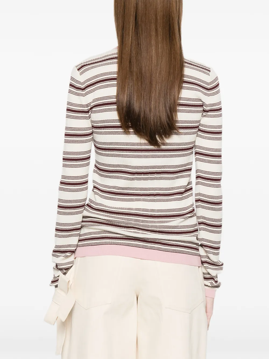 Brown shirt worn by a person, showing the shirt fit