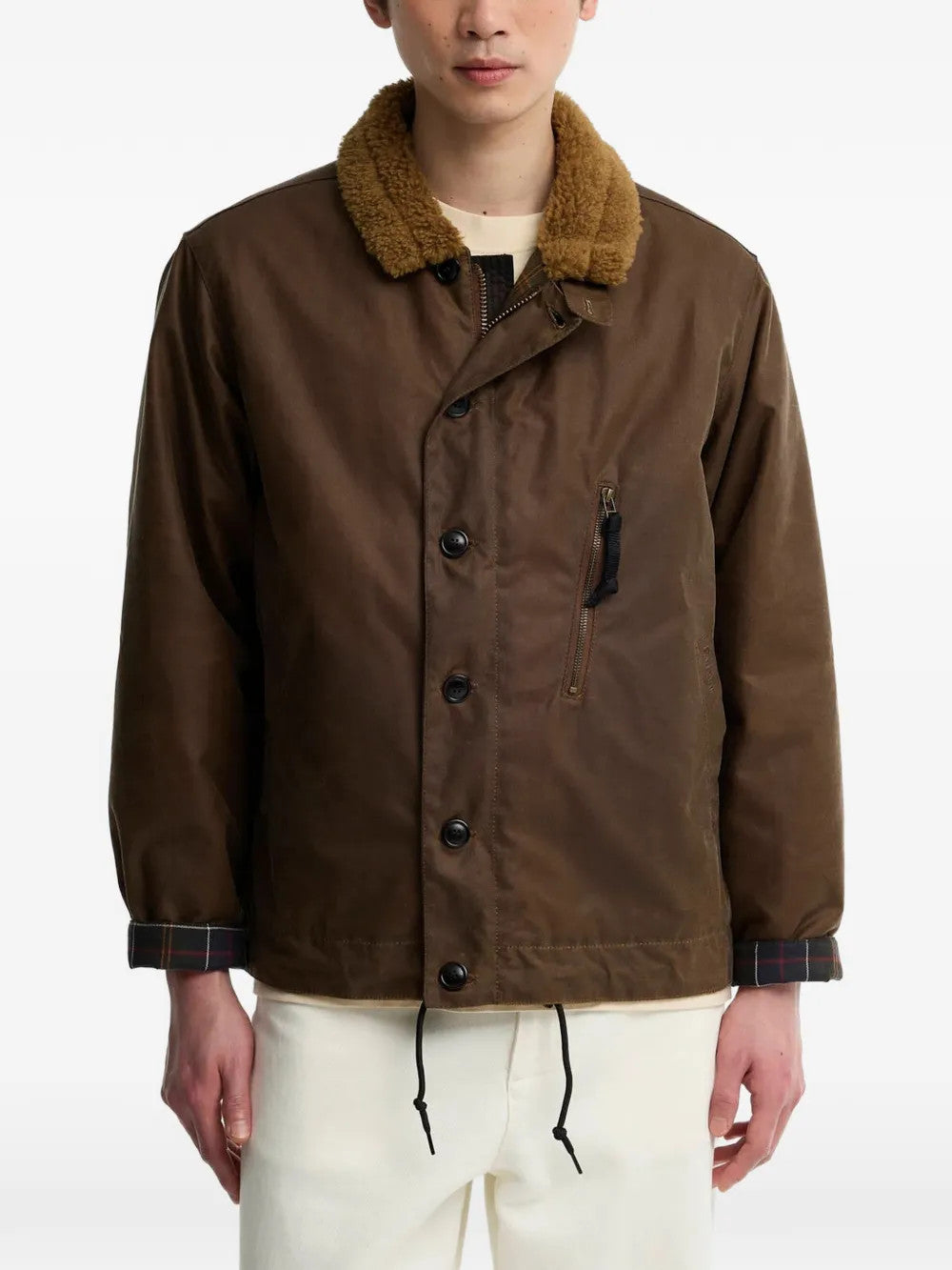 Brown jacket worn by a person, showing the jacket fit