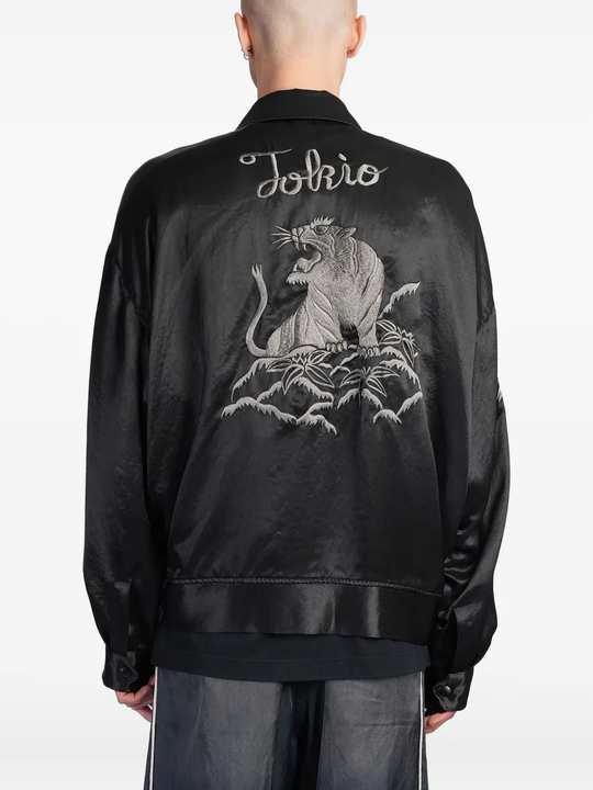 Black jacket worn by a person, showing the jacket's fit