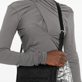black bag worn by a person, showing the bag fit