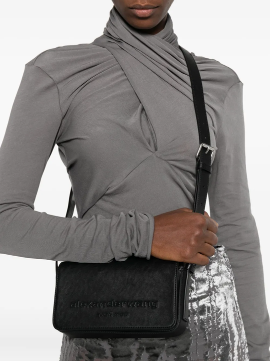 black bag worn by a person, showing the bag fit