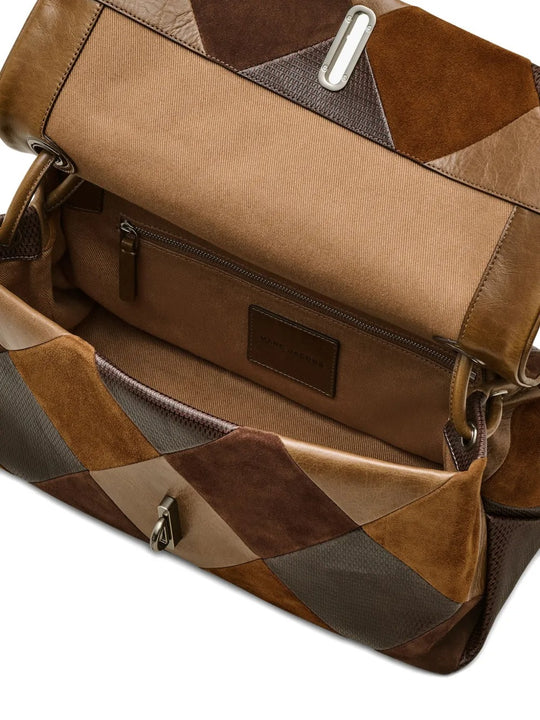 Close up of brown bag, showing texture of the leather fabric