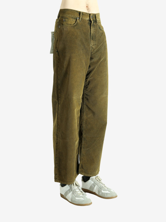 Green pant worn by a person, showing the pant's fit