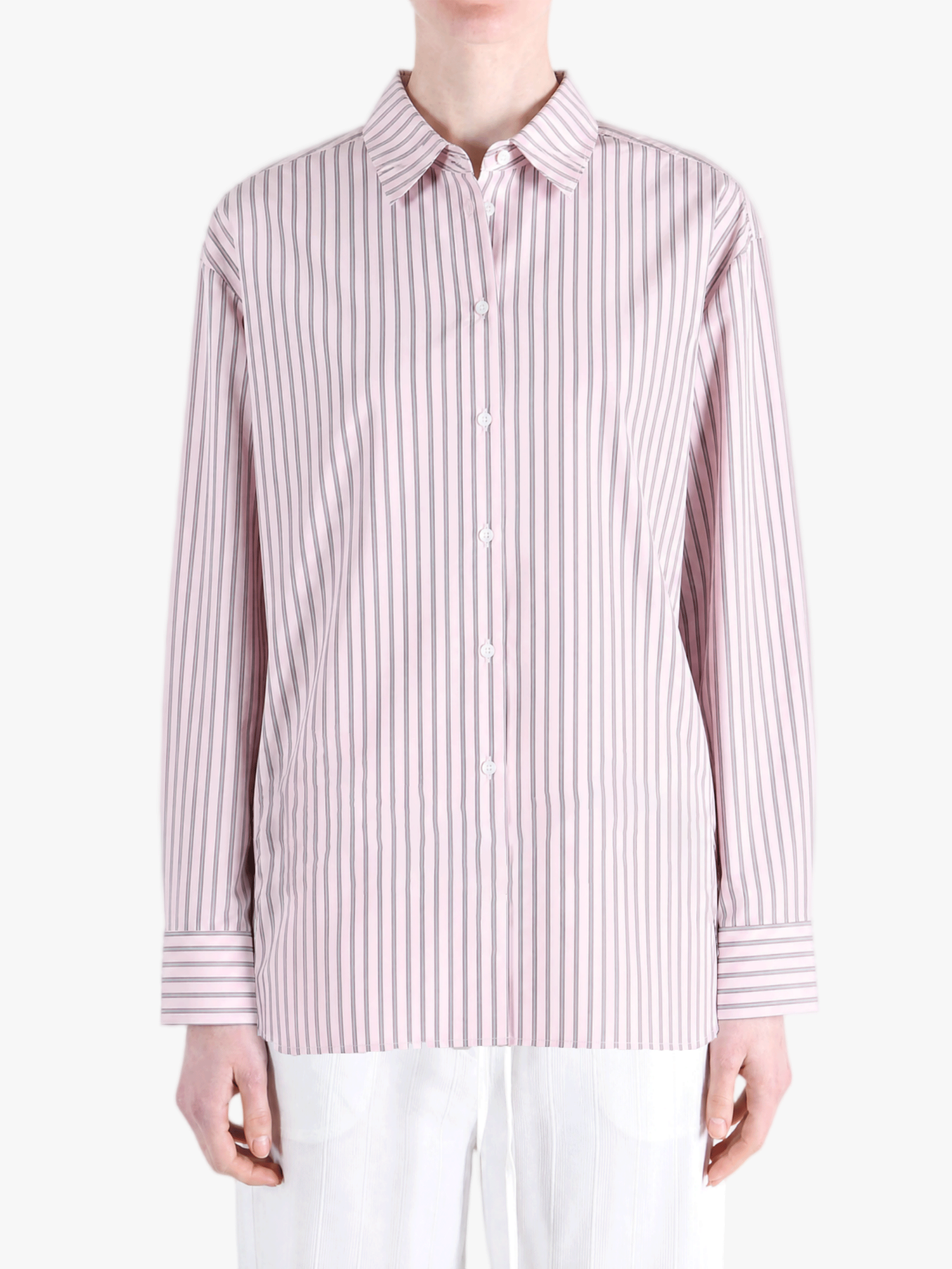 Pink shirt worn by a person, showing the shirt fit