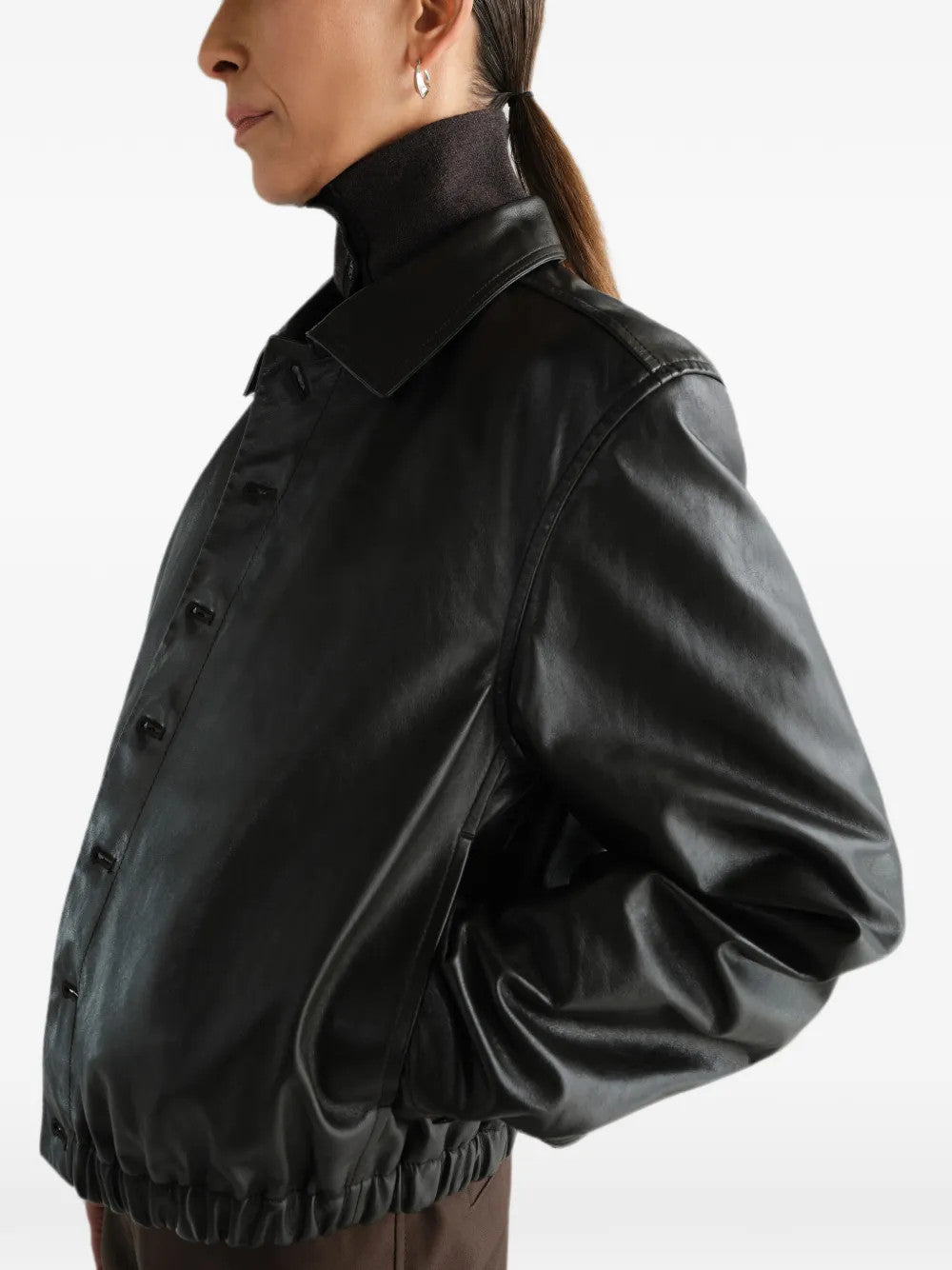 Black jacket worn by a person, showing the jacket fit