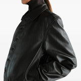 Black jacket worn by a person, showing the jacket fit
