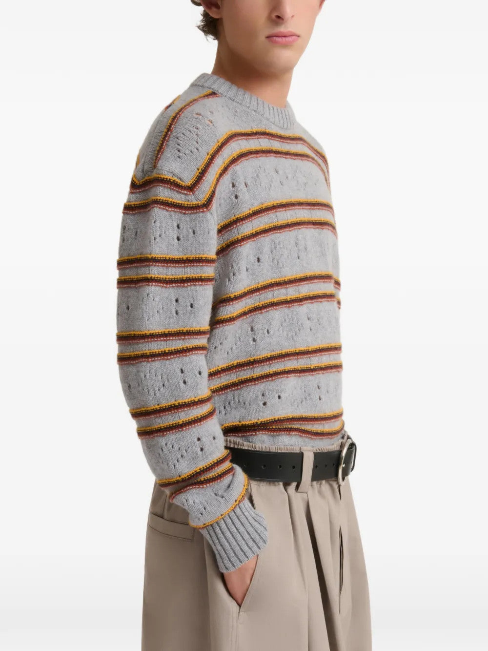 Grey knitwear worn by a person, showing the knitwear fit