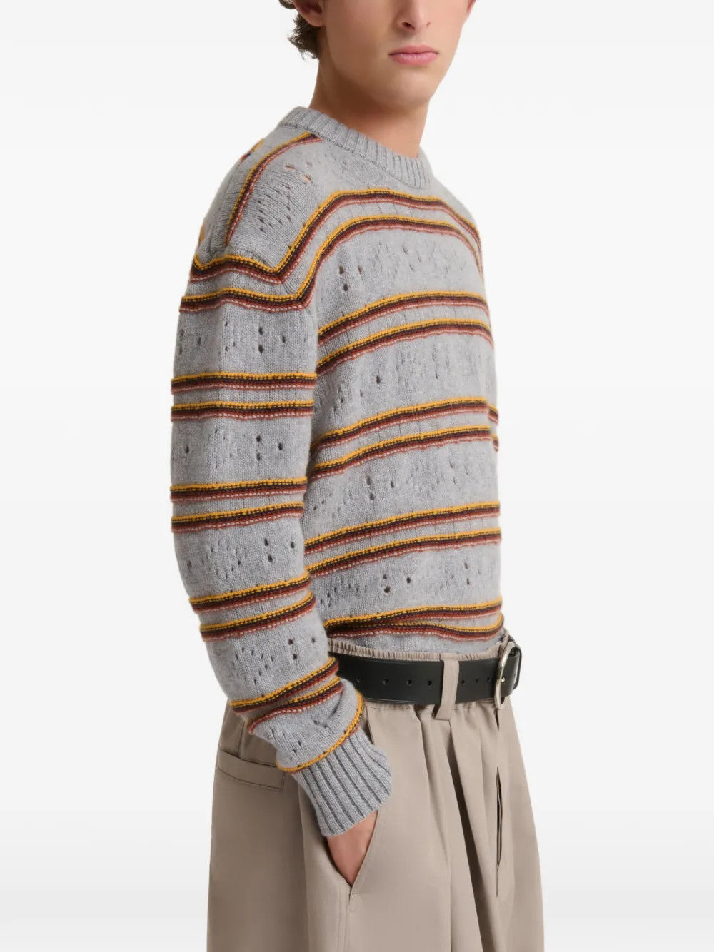 Grey knitwear worn by a person, showing the knitwear fit