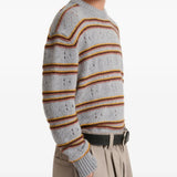 Grey knitwear worn by a person, showing the knitwear fit