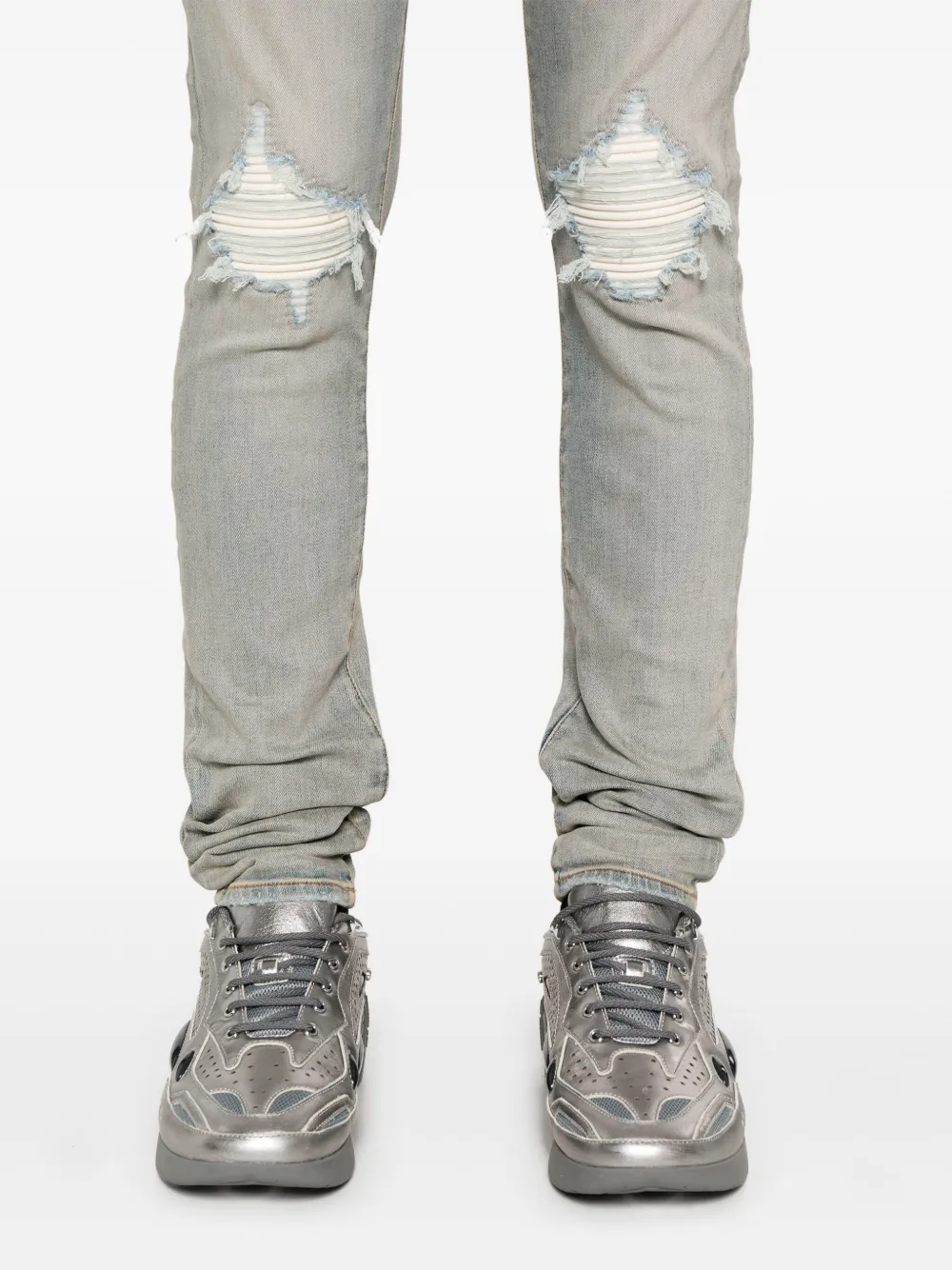 Close up of blue pants, showing texture of the cotton fabric.