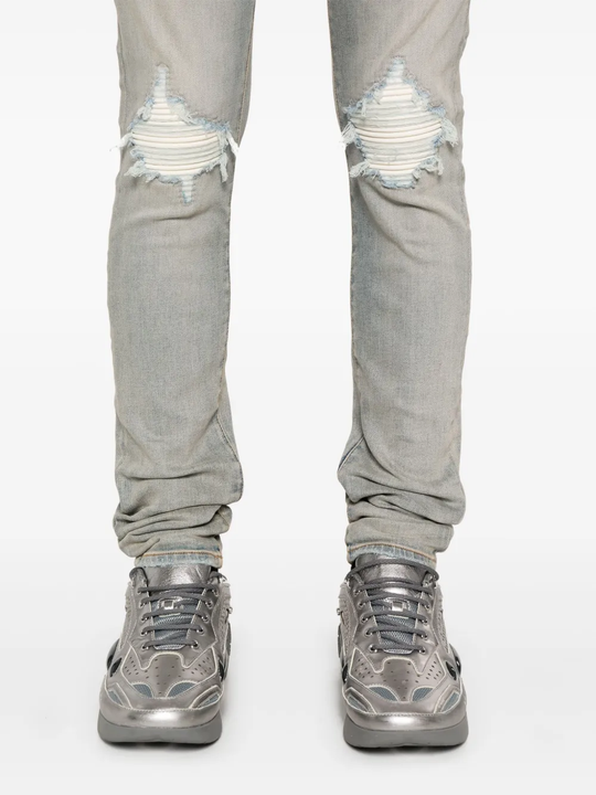 Close up of blue pants, showing texture of the cotton fabric.