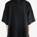 Black t-shirt worn by a person, showing the t-shirt's fit