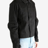 Black jacket worn by a person, showing the jacket's fit