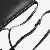 Close-up of black bag showing texture of the leather fabric