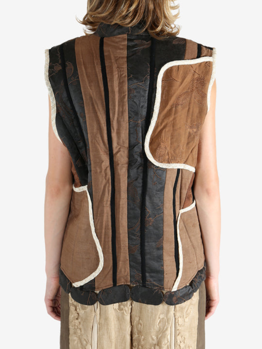 Black vest worn by a person, showing the vest fit