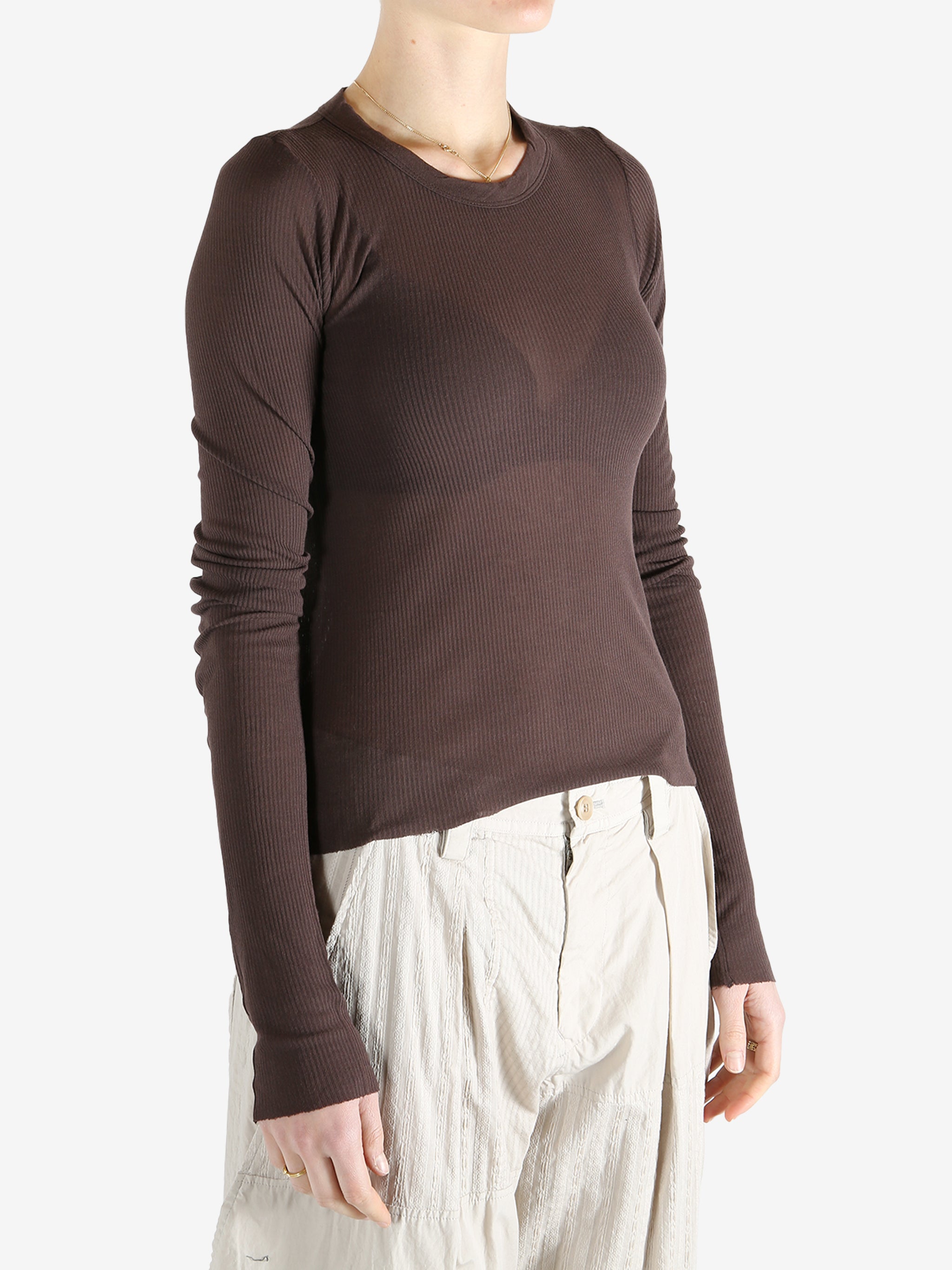 Brown t-shirt worn by a person, showing the t-shirt's fit