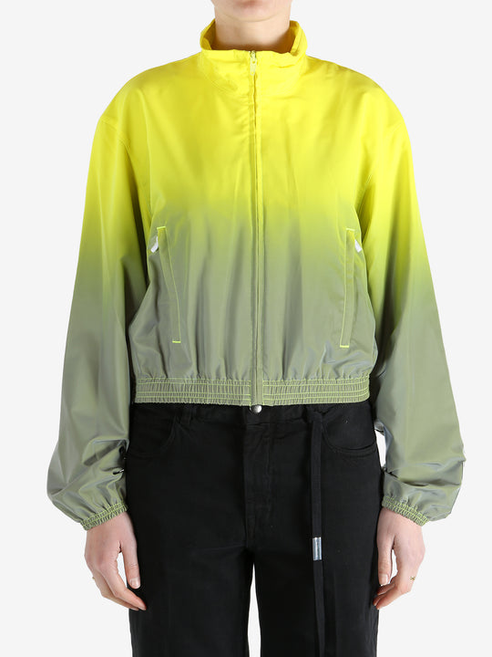 yellow jacket worn by a person, showing the jacket fit