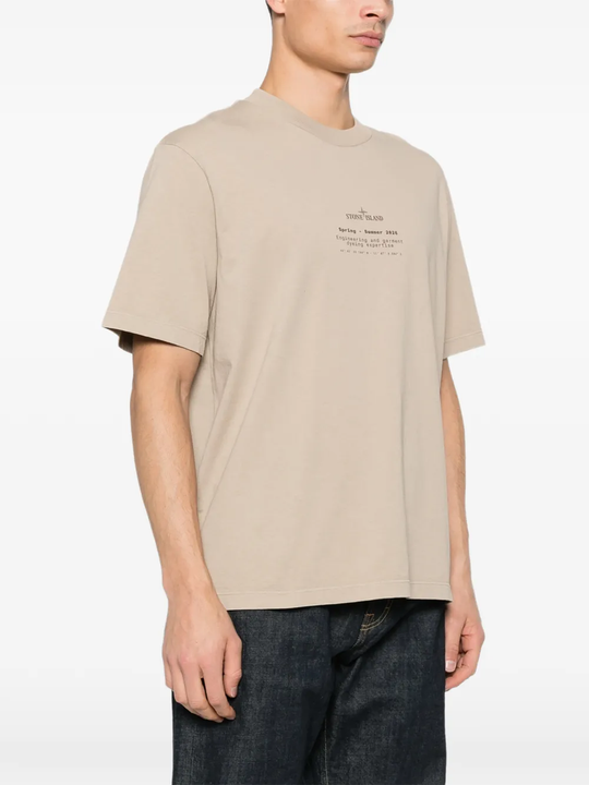 Tan t-shirt worn by a person, showing the tan t-shirt's fit