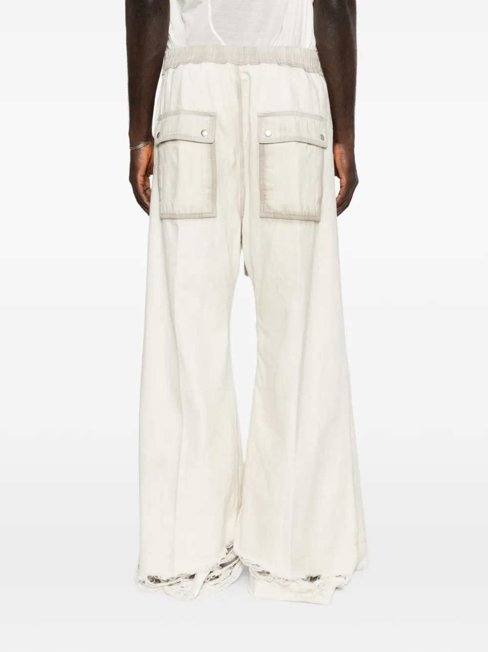 White pant worn by a person, showing the pant fit