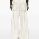 White pant worn by a person, showing the pant fit