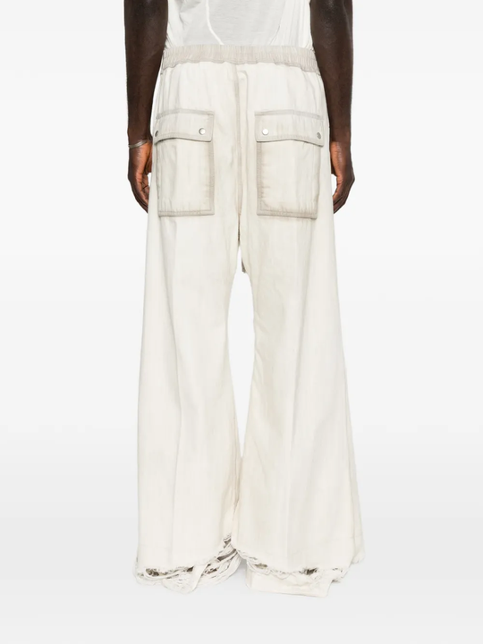 White pant worn by a person, showing the pant fit