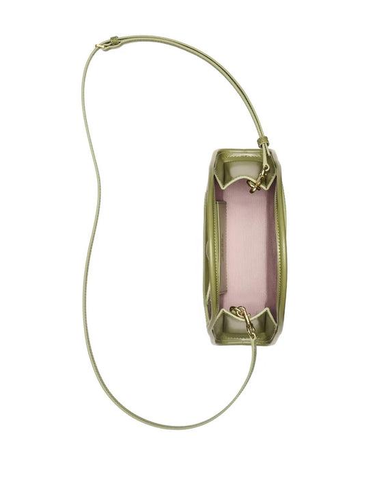 Close up of the green bag, showing texture of the leather fabric