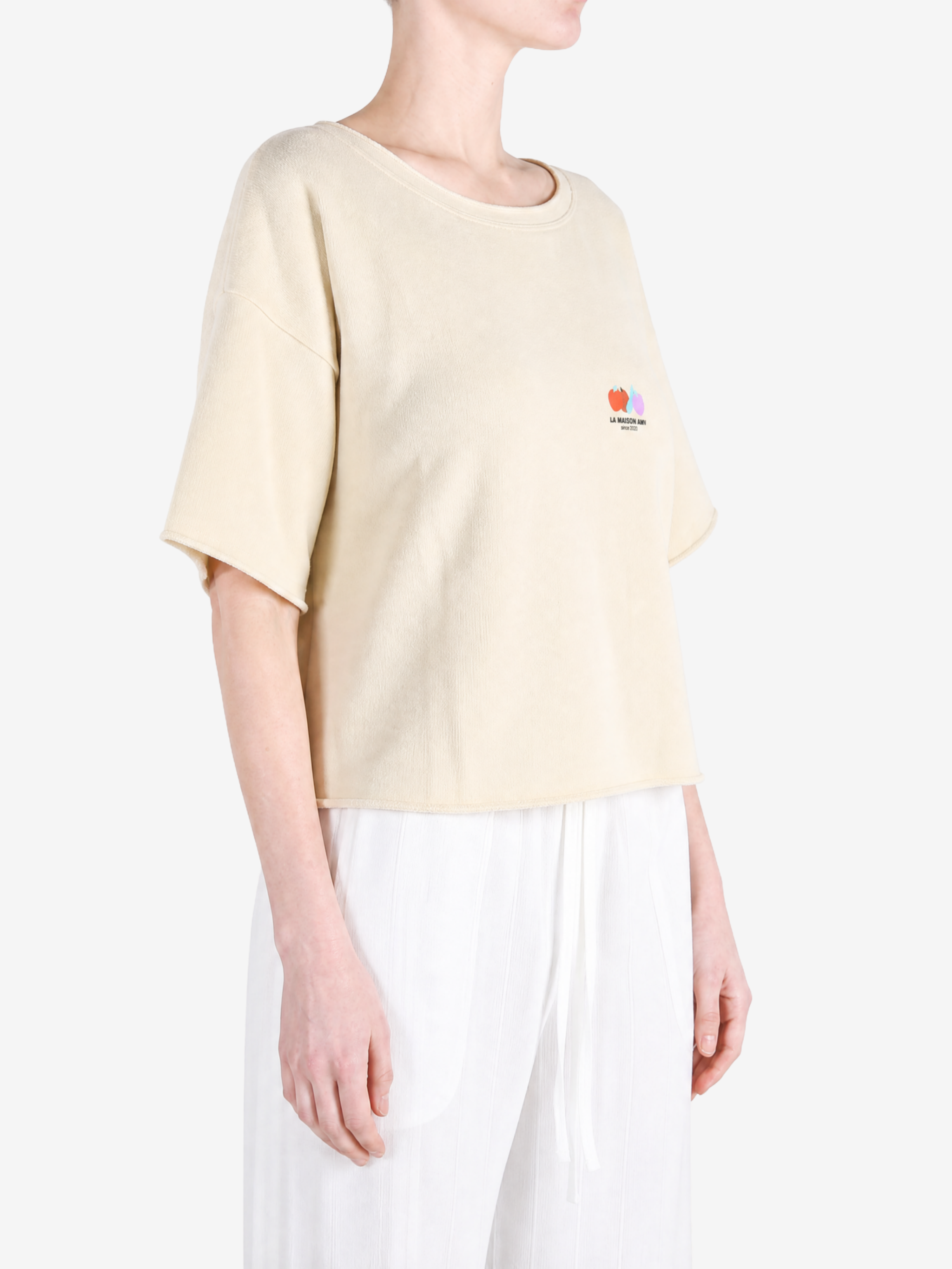Tan t-shirt worn by a person, showing the t-shirt fit